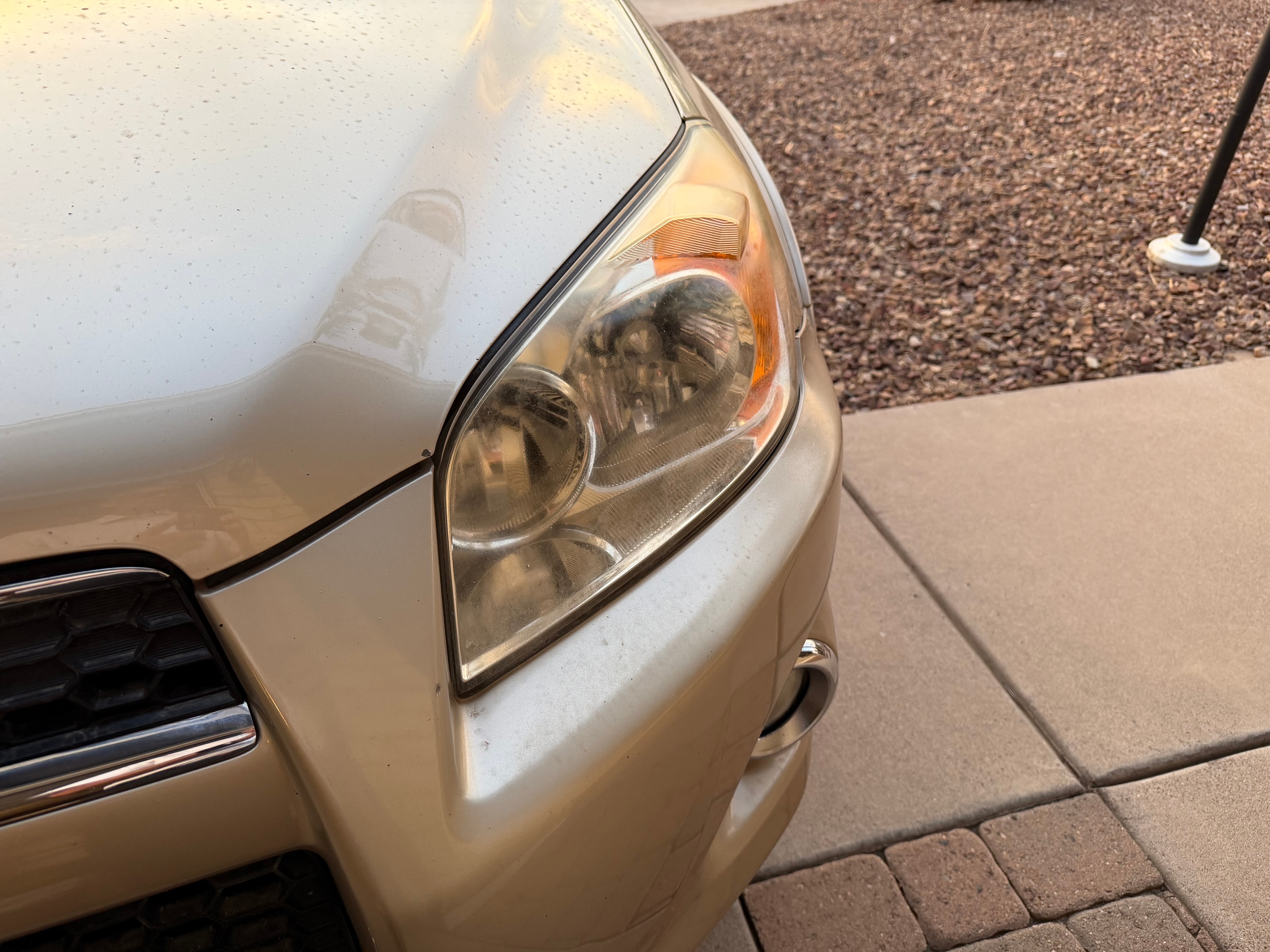 Cloudy vehicle headlight before restoration