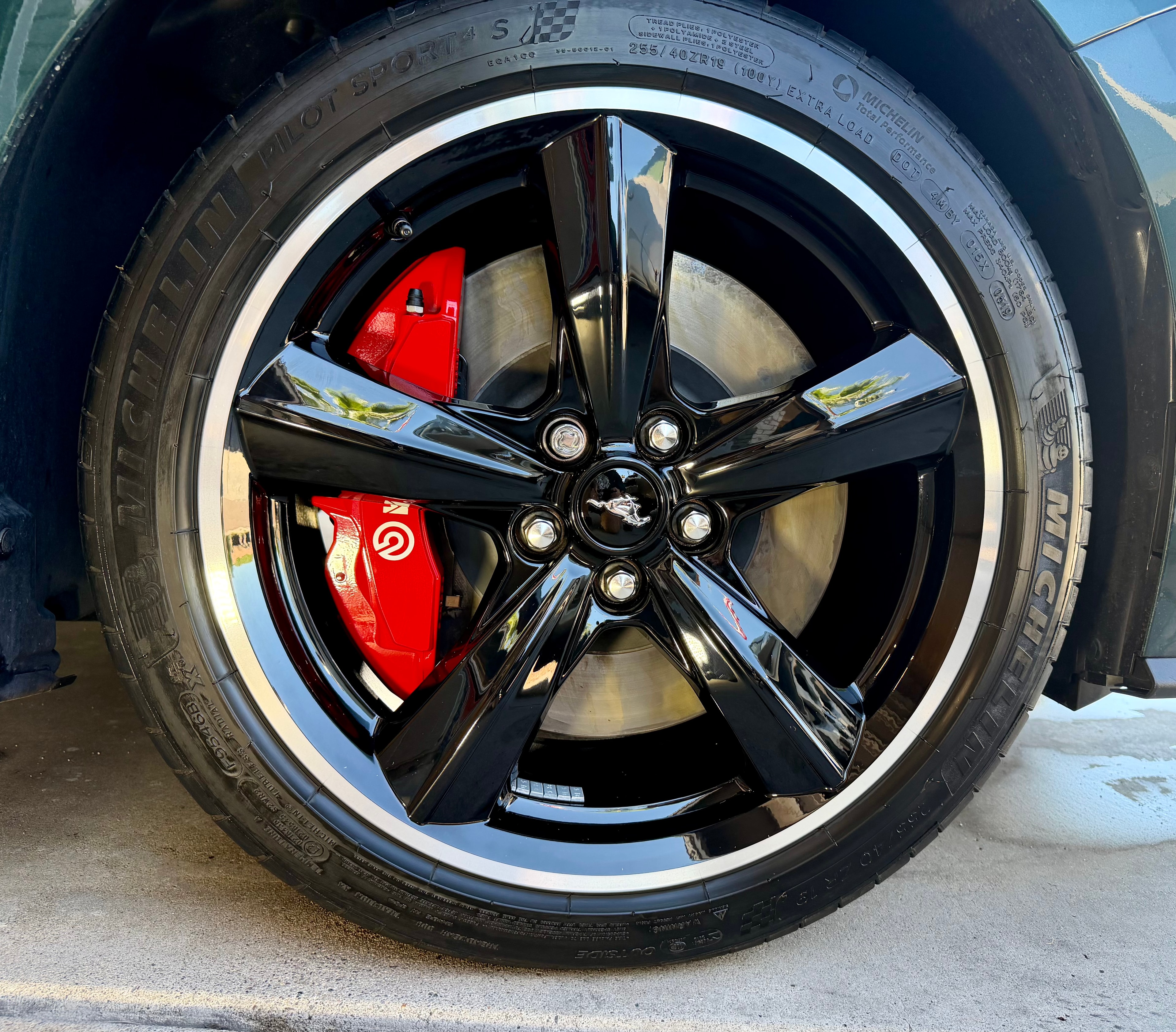 Wheel after ceramic coating treatment showing deep gloss finish